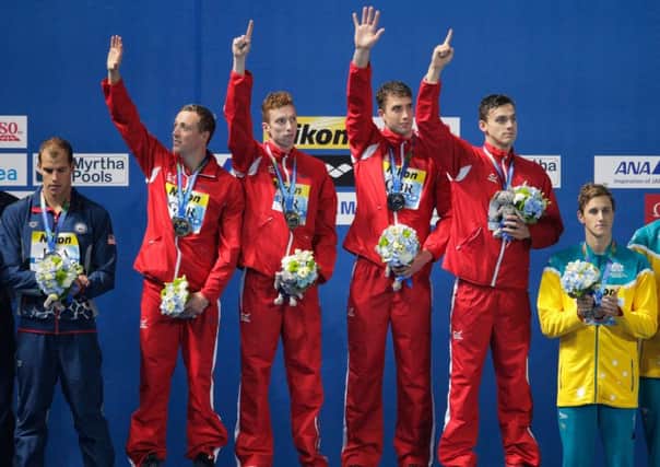 Robbie Renwick, Dan Wallace, Calum Jarvis and James Guy on the podium following their 4x200m relay victory. Picture: Getty