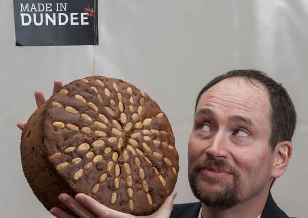 Dundee baker Martin Goodfellow with a specimen of the celebrated cake. Picture: Alan Richardson