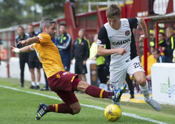 Motherwell's Keith Lasley, left, tussles with Blair Spittal. Picture: SNS