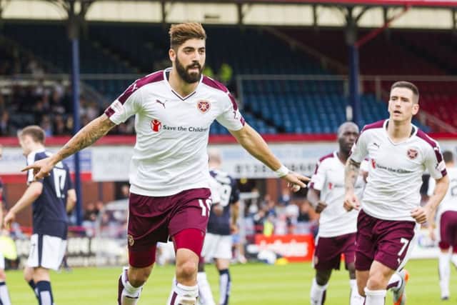 Juanma Delgado wheels away in celebration after netting the equaliser for Hearts. Picture: SNS