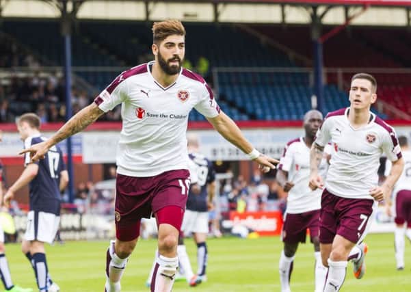 Juanma Delgado wheels away in celebration after netting the equaliser for Hearts. Picture: SNS