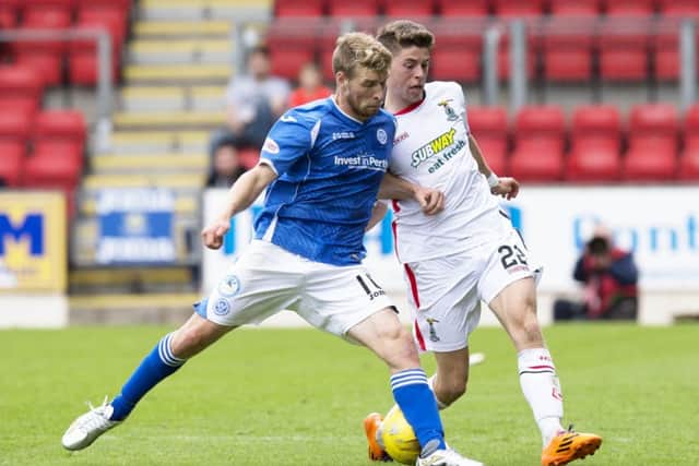 St Johnstone's David Wotherspoon tussles for the ball with Ryan Christie, right. Picture: SNS