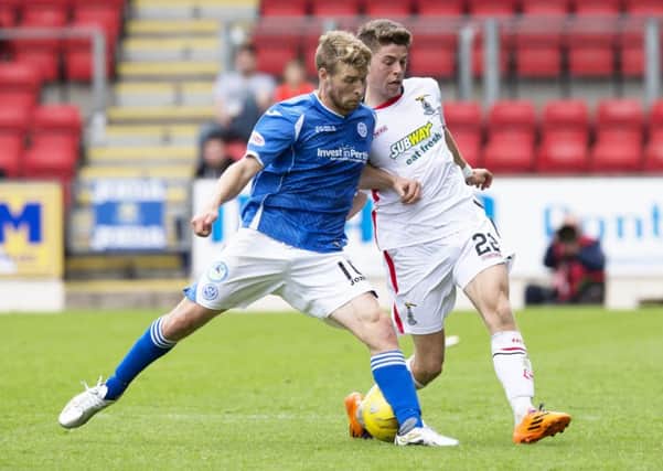 St Johnstone's David Wotherspoon tussles for the ball with Ryan Christie, right. Picture: SNS