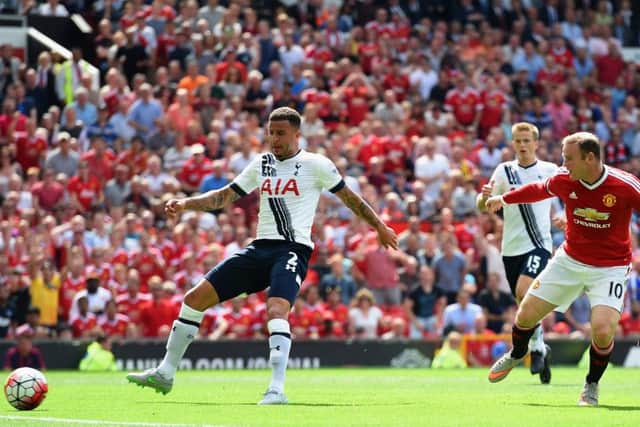 Kyle Walker pokes the ball into his own net as Wayne Rooney looks on. Picture: Getty Images