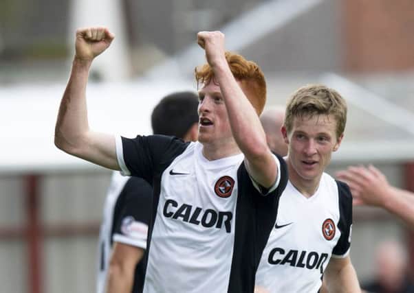 United striker Simon Murray celebrates his late goal which sealed victory. Picture: SNS