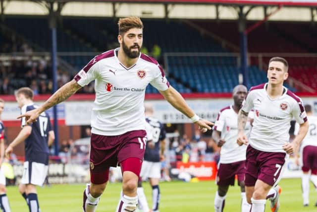 Juanma wheels away after scoring from the penalty spot to equalise for Hearts at Dens Park. Picture: SNS
