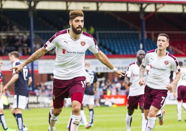 Juanma wheels away after scoring from the penalty spot to equalise for Hearts at Dens Park. Picture: SNS