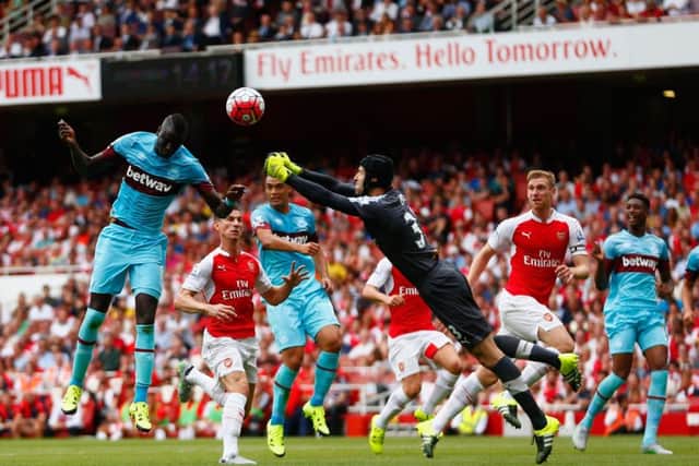 Arsenals goalkeeper Petr Cech fails to punch clear the ball as West Hams Cheikhou Kouyate heads in. Picture: Getty