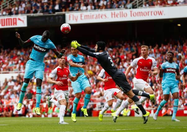 Arsenals goalkeeper Petr Cech fails to punch clear the ball as West Hams Cheikhou Kouyate heads in. Picture: Getty