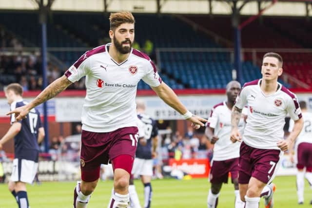 Juanma Delgado wheels away in celebration after netting the equaliser for Hearts. Picture: SNS