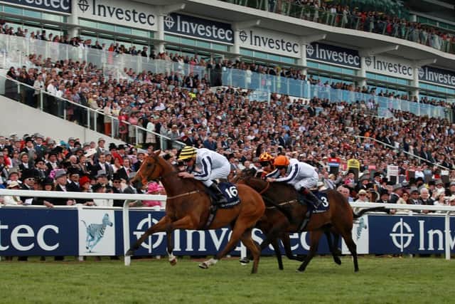Desert Law, left, wins the Epsom 'Dash' in June. Picture: Getty
