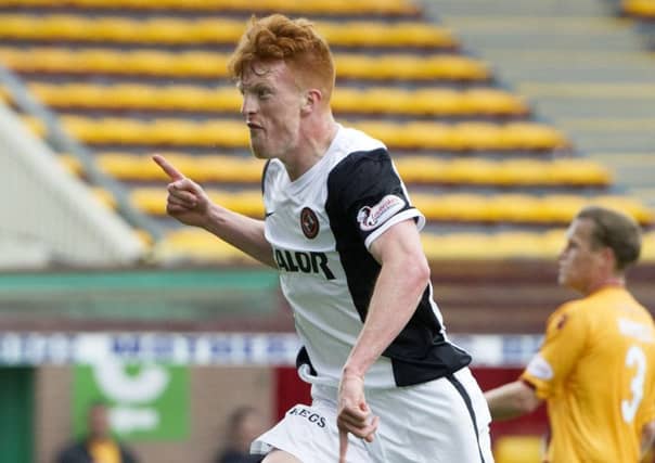Simon Murray, right, celebrates scoring his first goal for United on Saturday. Picture: SNS