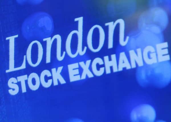 The FTSE 100 rose despite the grocery hit. Picture: AP Photo/ Alastair Grant
