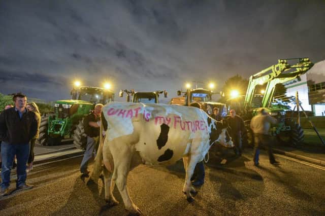 Hundreds of farmers blockade an Asda distribution depot in Wigan as dairy protests grow across the UK. Picture: Michael Scott/Demotix