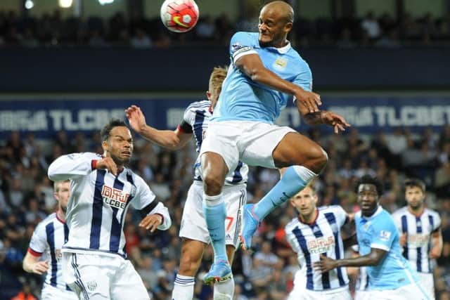 Manchester City captain Vincent Kompany scores his side's third goal against West Brom at The Hawthorns last night. Picture: Rui Vieira/AP