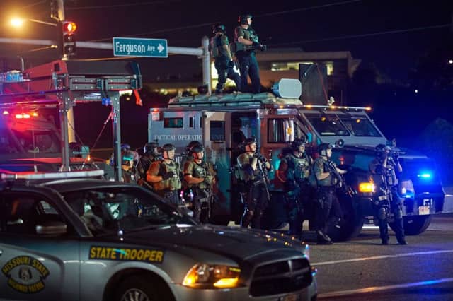 Local police and state troopers were out in force on the streets of Ferguson as protests continued. Picture: Getty