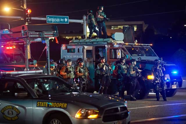 Local police and state troopers were out in force on the streets of Ferguson as protests continued. Picture: Getty