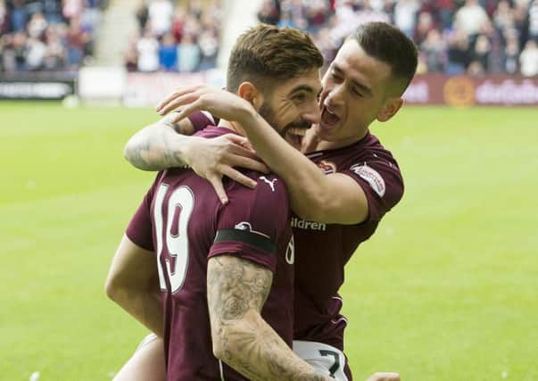 Robbie Neilson has said that efforts to make Hearts' foreign recruits such as Juanma, left, feel welcome has helped his side maintain a 100 per cent record in the Scottish Premiership so far. Picture: Ian Rutherford