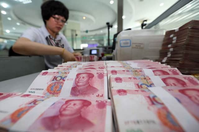 China's central bank devalued its yuan currency by nearly two percent against the US dollar. Picture: Getty