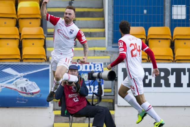 Craig Curran (left) celebrates scoring County's opener. Picture: SNS