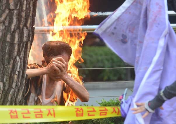 Choi Yeon-yeol, an 80-year-old, suffered third degree burns after setting himself on fire. Picture: Getty