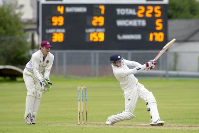 Michael Leask smashes the ball to the boundary to bring up his hundred at Titwood. Picture: Donald MacLeod