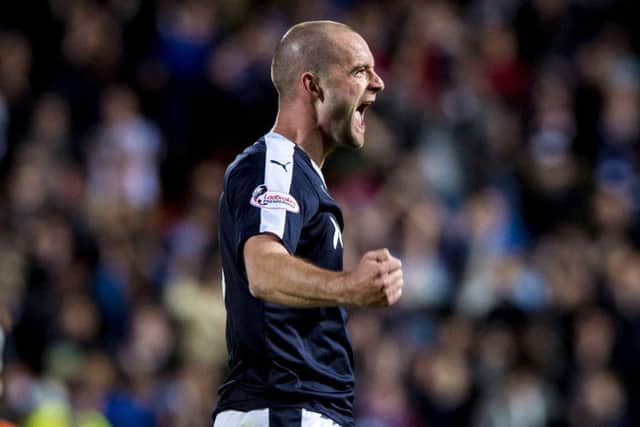 James McPake celebrates his late equaliser against derby rivals Dundee United. Picture: SNS