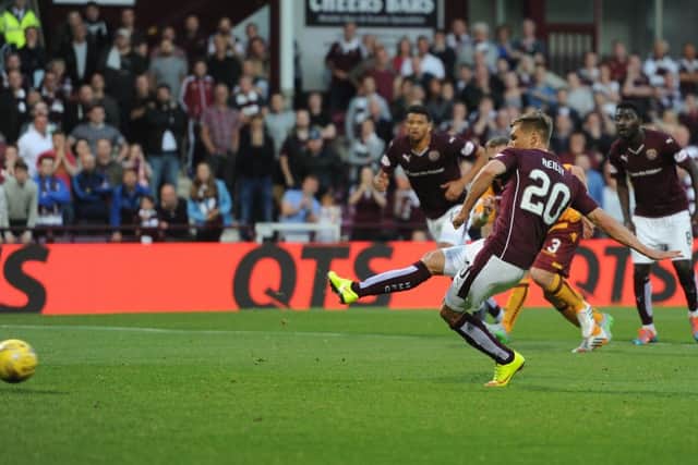 Gavin Reilly scores from the penalty spot for Hearts. Picture: Neil Hanna