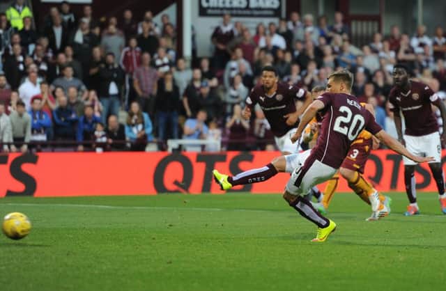 Gavin Reilly scores from the penalty spot for Hearts. Picture: Neil Hanna