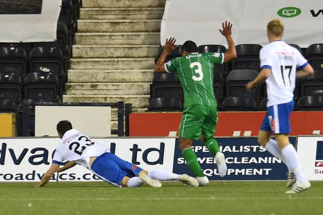 Celtic's Emilio Izaguirre (3) brings down Greg Kiltie to concede a late penalty. Picture: SNS