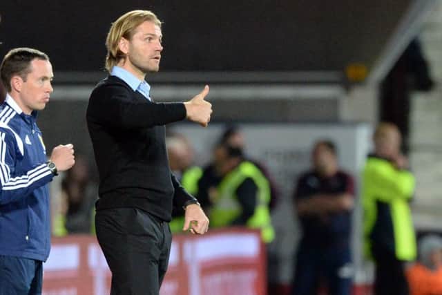 Hearts boss Robbie Neilson gives his side the thumbs up. Picture: SNS