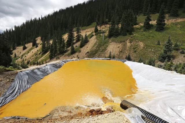 Water flows through a retention pond outside Silverton, built to contain and filter out heavy metals and chemicals from the Gold King mine wastewater accident. Picture: AP