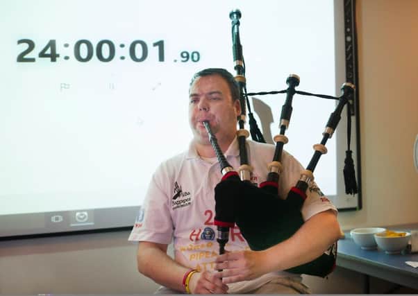 Rikki Evans as he completes his attempt to break a Guinness World Record by playing bagpipes for 24 hours as part of Piping Live! Picture: John Devlin