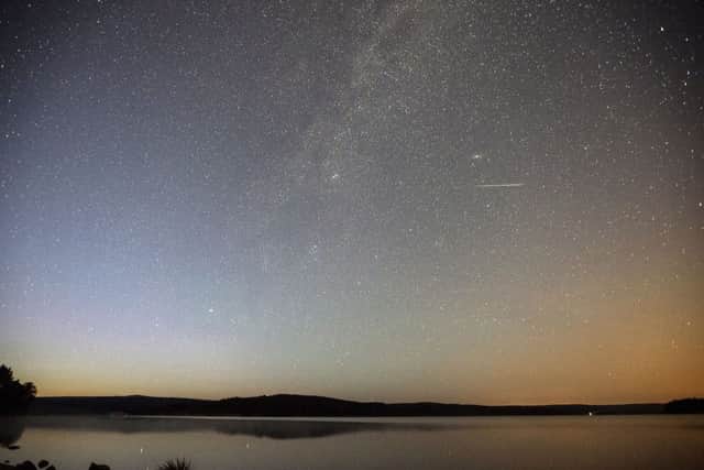 A shooting star in the skies over Kielder Water, Northumberland. Picture: PA
