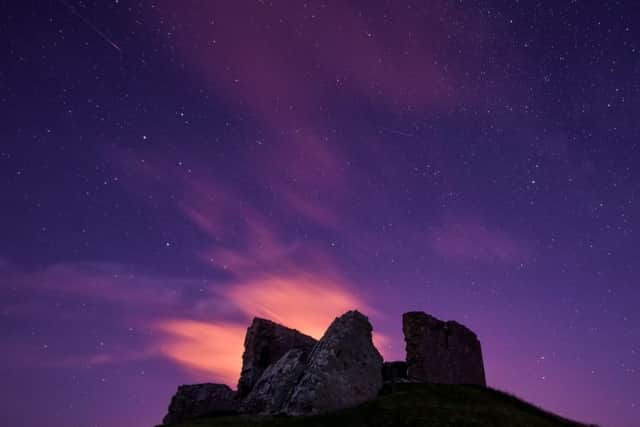 Meteors are seen passing over the ruins of Duffus Castle in Morayshire. Picture: PA