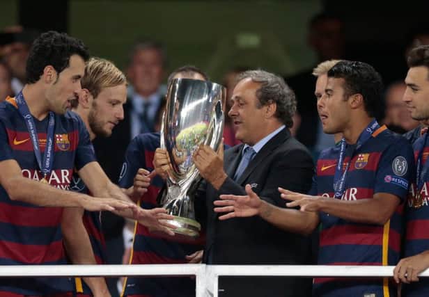 Michel Platini, presenting the Super Cup to Barcelona in Tbilisi, has been president of Uefa since 2007. Picture: Ivan Sekretarev/AP