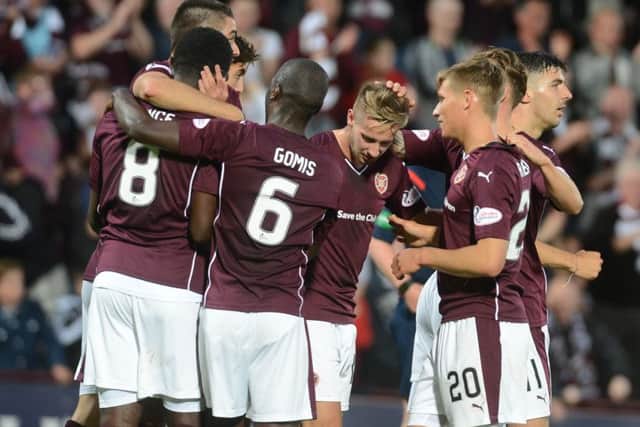 Billy King (centre) is mobbed by his team-mates after scoring the second goal against Motherwell. Picture: Neil Hanna