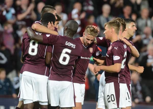 Billy King (centre) is mobbed by his team-mates after scoring the second goal against Motherwell. Picture: Neil Hanna