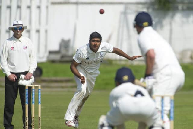 Scotland bowler Harris Aslam sends down a delivery past  umpire Neil Davidson. Picture: Donald MacLeod