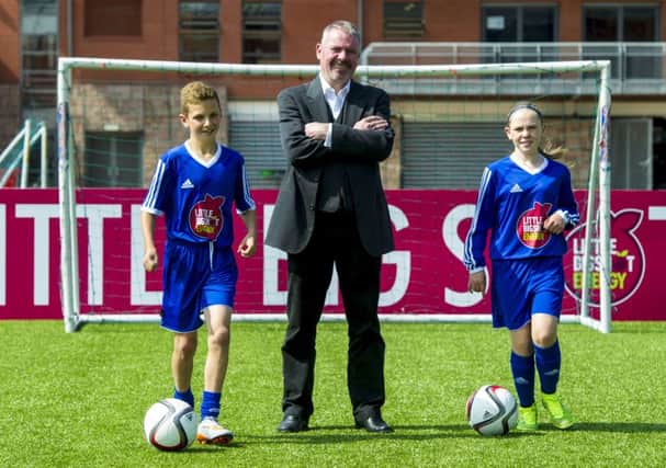 Performance director Brian McClair welcomes Darren Watson and Neve Guthrie to Hampden Park yesterday. Picture: SNS