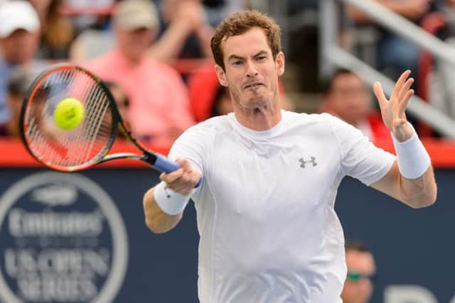 Andy Murray breezed into the quarter finals but lost out to brother Jamie in the doubles. Picture: Getty