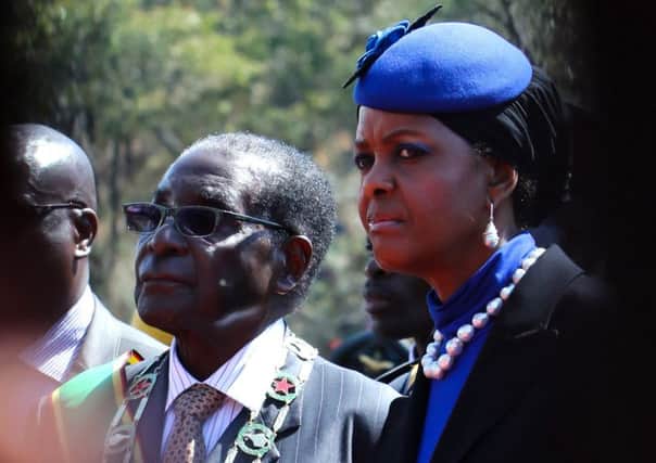 President Mugabe and wife Grace raised issue of tribal skulls at Heroes' Day rally this week. Picture: AFP/Getty