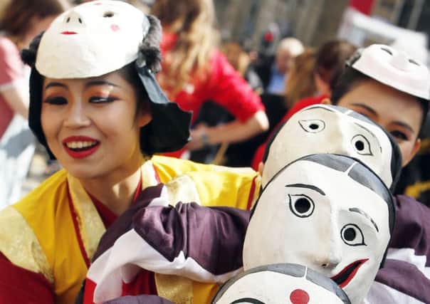 Korean performers promote the Edinburgh Festival Fringe show Pan on the Royal Mile in Edinburgh. Picture: PA