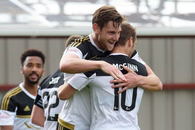 Aberdeen defender Ash Taylor celebrates his winning goal with fellow scorer Niall McGinn. Picture: Alan Harvey/SNS