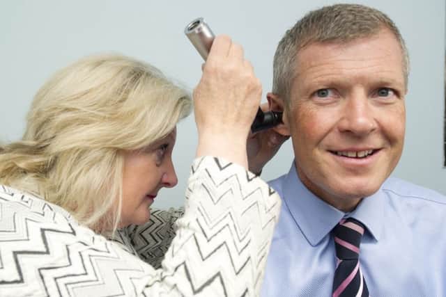 Scottish Liberal Democrat leader Willie Rennie with GP Dr Lynn Wilson at the launch of his report examining working hours of GPs. Picture: Ian Rutherford
