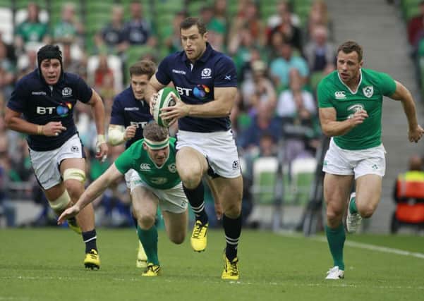 Tim Visser breaks through Ireland's Gordon D'Arcy, left, and Tommy Bowe in Dublin. Picture: AP