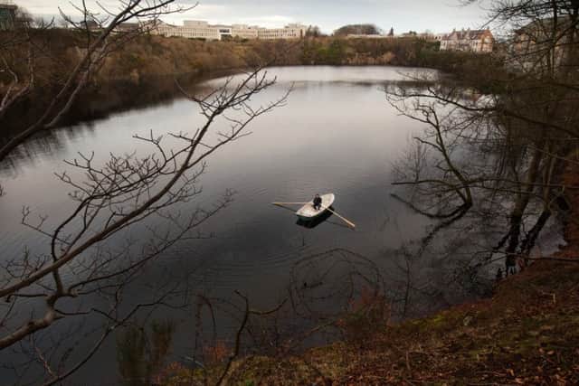 Hugh Black takes a small boat out on Rubislaw quarry in Aberdeen.   Picture: Robert Ormerod