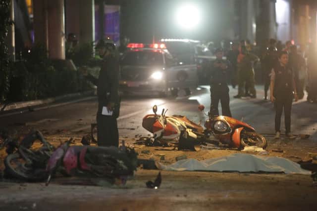 Motorcycles and debris lie on the pavement. Picture: AP