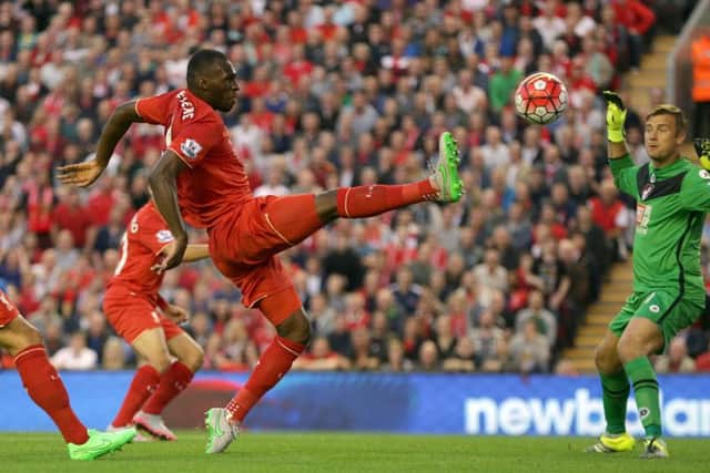 Liverpool's Belgian striker Christian Benteke nets his controversial winner against Bournemouth at Anfield last night. Picture: Clint Hughes/AP