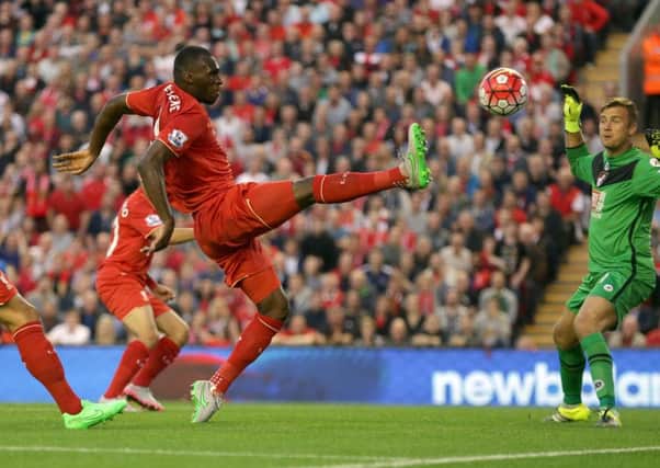 Liverpool's Belgian striker Christian Benteke nets his controversial winner against Bournemouth at Anfield last night. Picture: Clint Hughes/AP